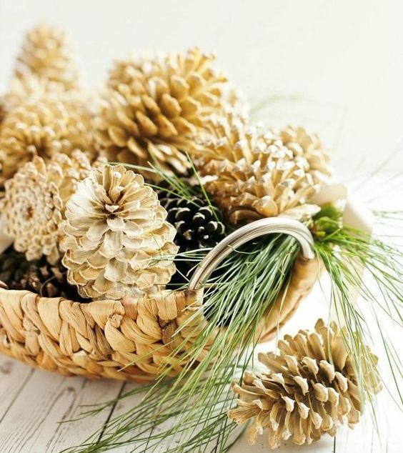 A wicker bowl with usual and bleached pinecones looks pretty   just add some evergreens