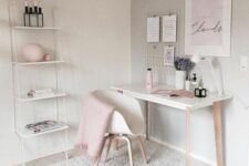 an airy Scandinavian workspace with dove grey walls, a lightweight desk and a white chair, pink decor and details