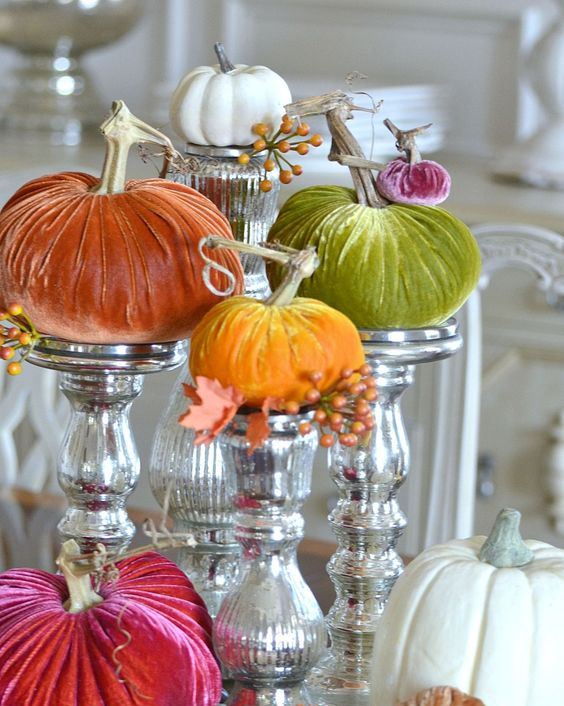 colorful velvet pumpkins on mercury glass stands is a whimsy and fun fall centerpiece to rock