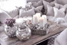 glam rustic styling with mercury glass vases, a woven tray with candles and some wine glasses