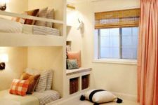 white built-in bunk beds with wall lamps and railing along the upper bed to keep the kid safe