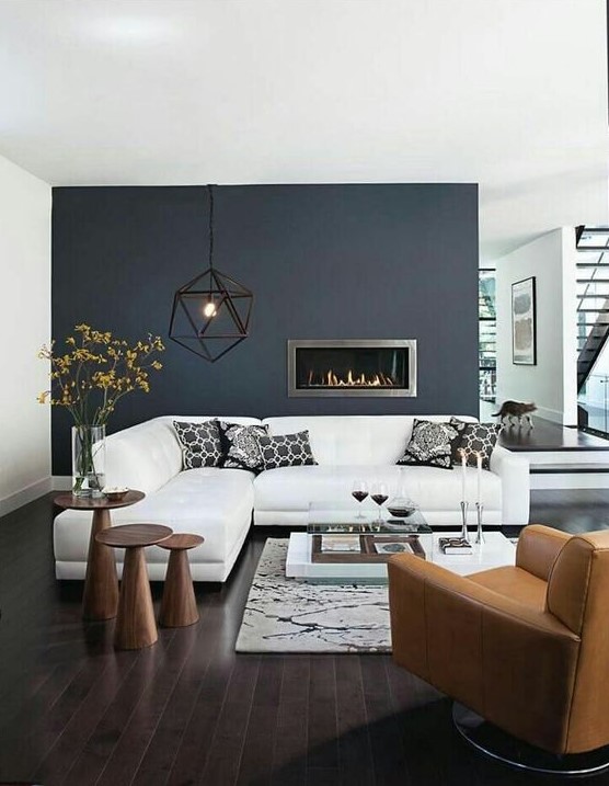 a black statement wall with a built-in ethanol fireplace that instantly adds coziness