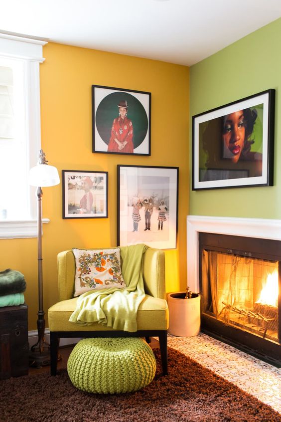 a colorful fireplace nook with a green and yellow wall, a gallery wlal, a built-in fireplace, a neon yellow chair and a neon green ottoman