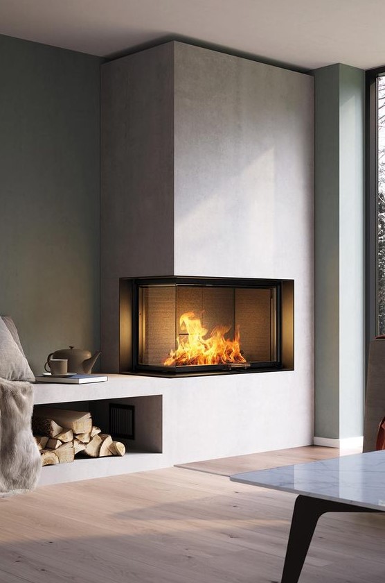 A contemporary built in fireplace in neutrals with a glass cover and a firewood storage space is a stylish decoration