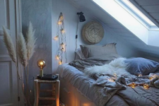 faux fur, pampas grass and lights here and there make the bedroom very welcoming and very cozy