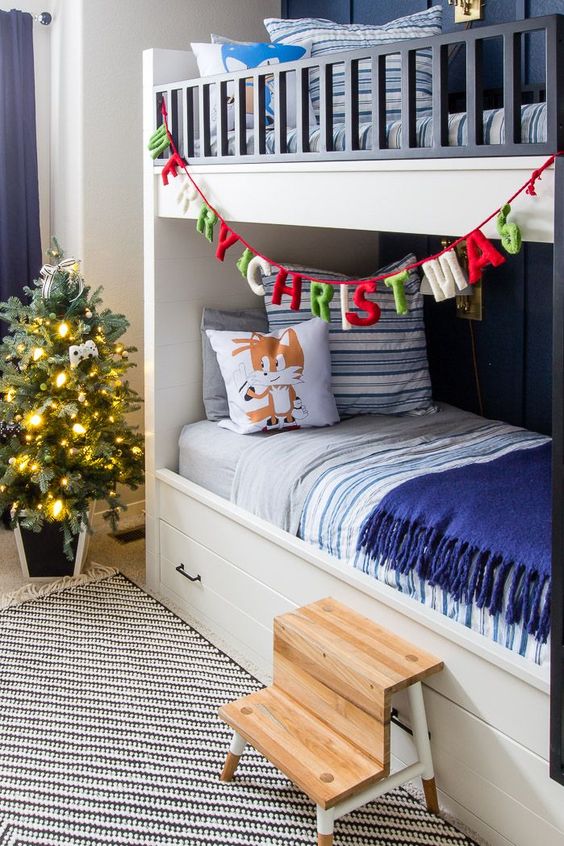 a colorful letter banner and a Christmas tree with lights will bring a cool holiday feel to the space