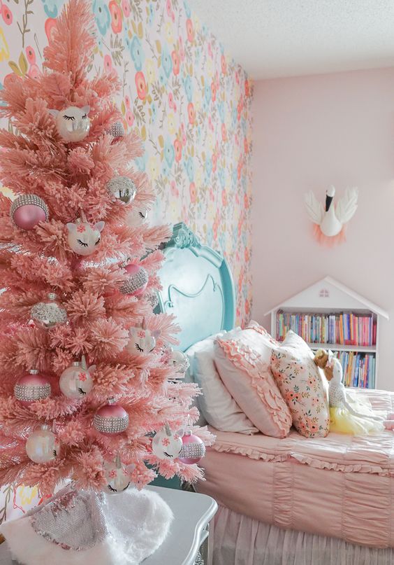a pink Christmas tree with various ornaments will easily bring a holiday feel to your kid's room and will make it amazing