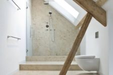 a contemporary attic bathroom with wooden beams, a neutral shower space and warm tiles on the floor