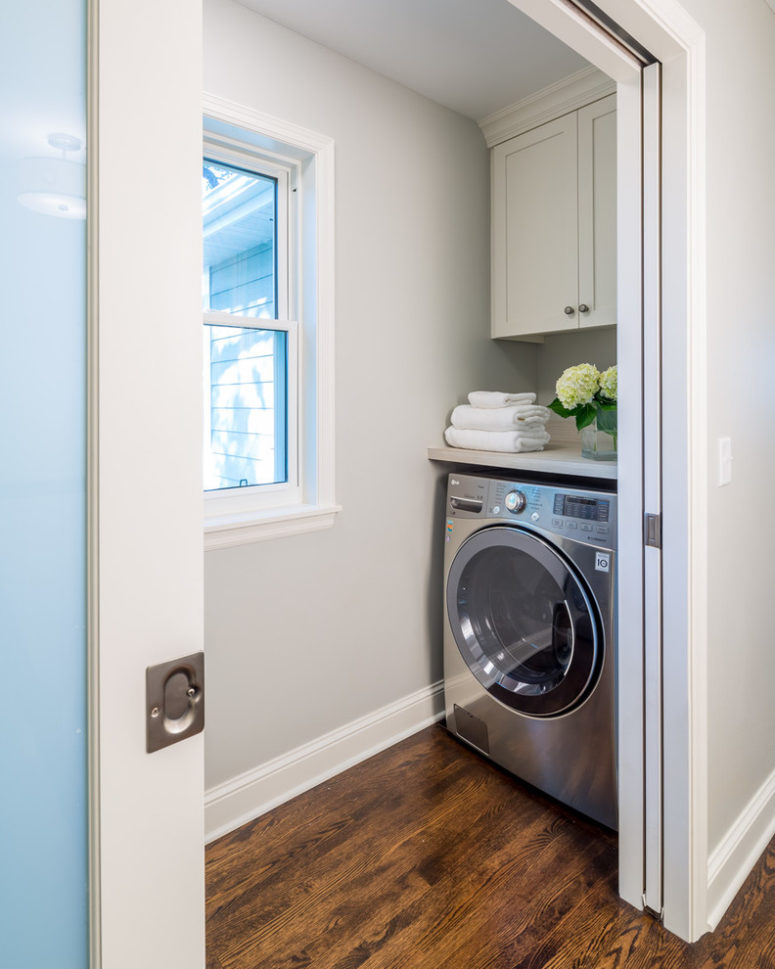 Turn an awkward corner into a tiny laundry room. (Sicora Design/Build)
