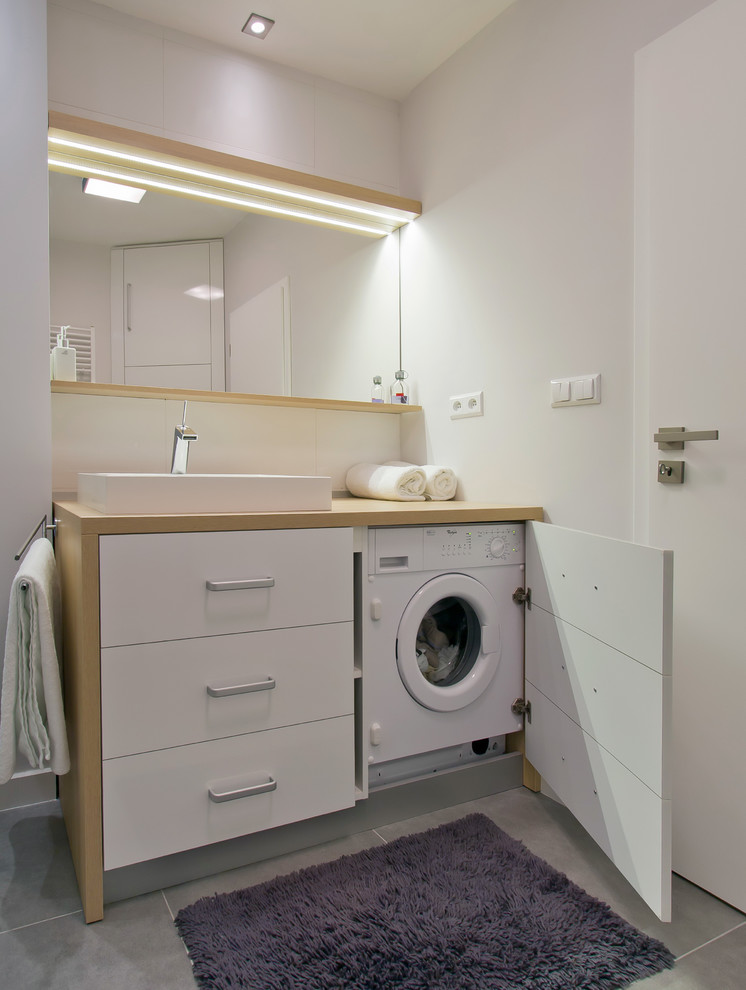You can fit a washer-dryer combo even in a tiny bathroom. (Goldfish-Interiors)