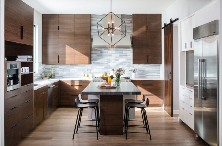 a rich-stained mid-century modern kitchen with a grey tile backsplash, a large kitchen island with an eating zone  (KW Designs)