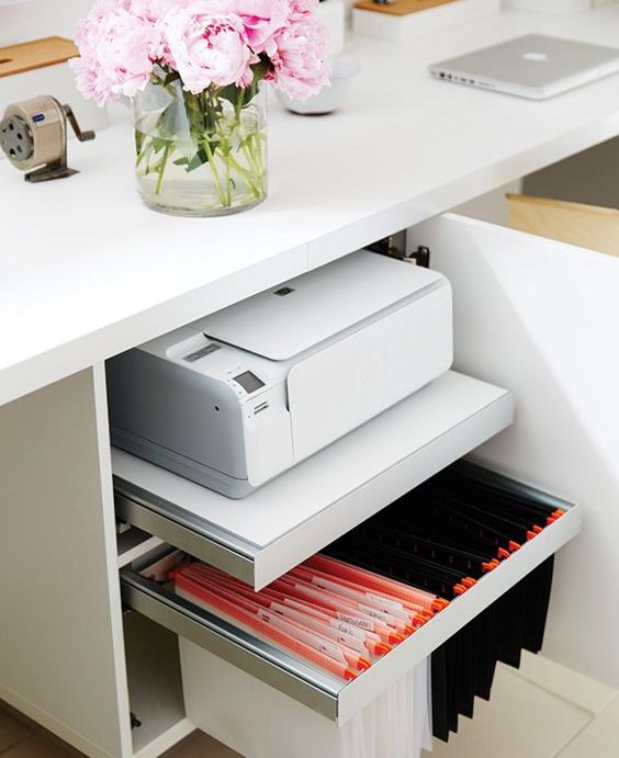 A desk with hidden storage   a file organizer and a shelf with a printer for comfortable storage and miximal functionality