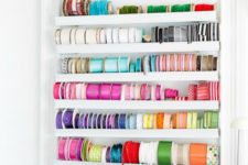 a storage unit with ledges is ideal for storing colorful ribbons and washi tape