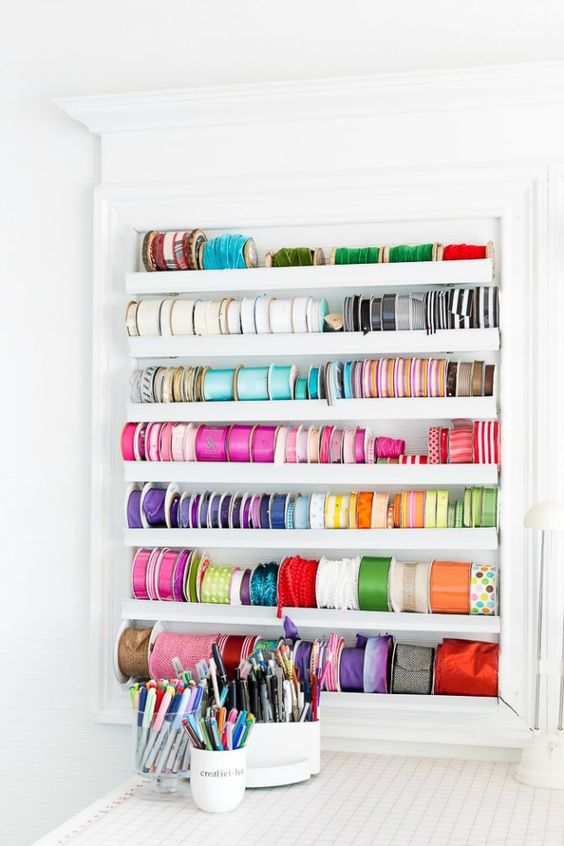 a storage unit with ledges is ideal for storing colorful ribbons and washi tape