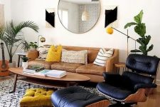 a stylish mid-century modern living room with a leather sofa, a lovely oval coffee table, a black lounger