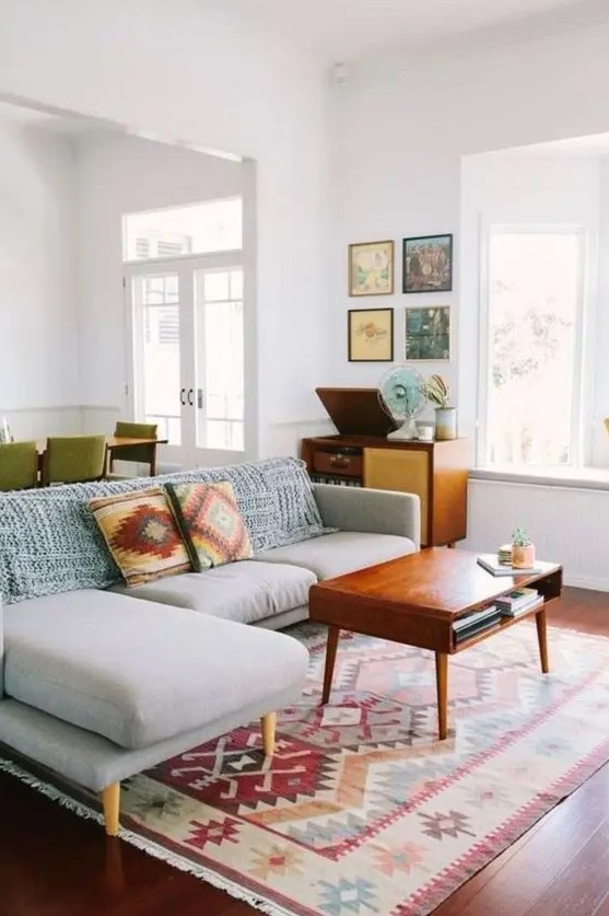 Abstract pillows and a rug are great for sprucing up the space and making it mid century modern