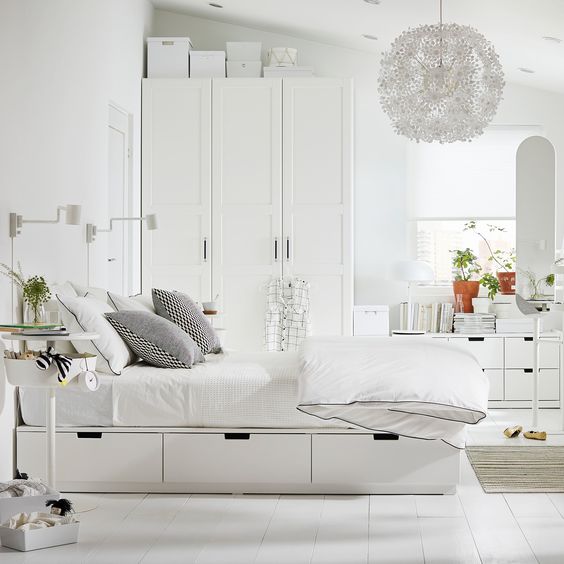 IKEA Nordli bed is a classic piece with storage drawers and a headboard that also features shelves for various units