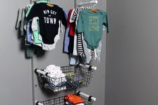 a baby clothes rack with holders, wire baskets and opne shelves is a cool idea to go for