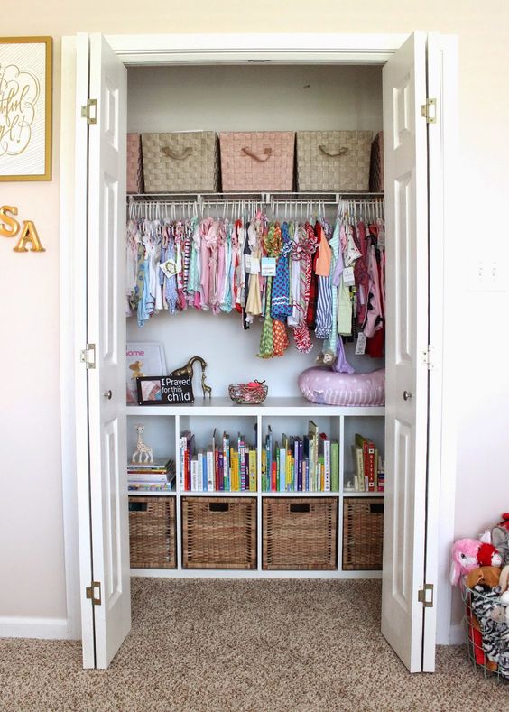 a closet done with baskets and woven boxes plus clothes hangers is a stylisha nd very accurate idea