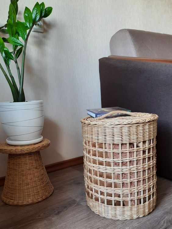 a cool wicker basket with a lid for storing pillows or blankets, and it can double as a side table in a rustic space