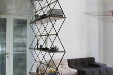 a lightweight doorway storage unit with many shelves is a cool way to separate spaces with style and provide some storage and decor