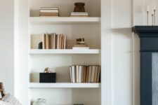 a niche with a series of shelves is a stylish idea for any space, here it’s used to display books and vases of various kinds