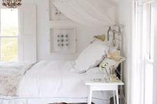 a pretty white bed with some woven baskets for storage is a nice option for those who don’t have a ready storage bed