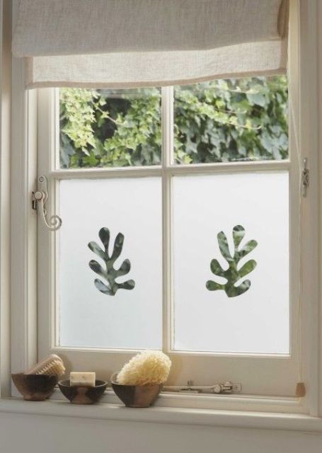 bathroom windows done with decorative frosting film to make the space more private