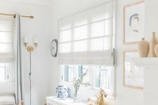 neutral fabric shades paired with light blue curtains will make this kid’s room all private and still filled with light