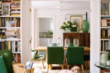 open shelves around the doorway and a long shelf over it are used to display vases and books is a cool idea to incorporate a touch of color and store things