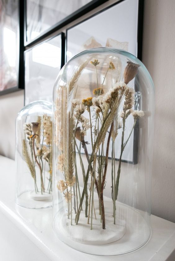 simple and chic Scandinavian decor – dried blooms and herbs in cloches are great for decorating for spring and such decor will last long