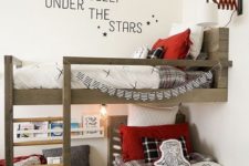 a chic modern farmhouse shared tene boy bedroom with a wooden bunk bed, some shelves and lights