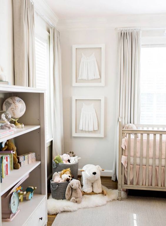 a neutral nursery with blush bedding, modern furniture, creamy curtains and a creamy rug is all chic