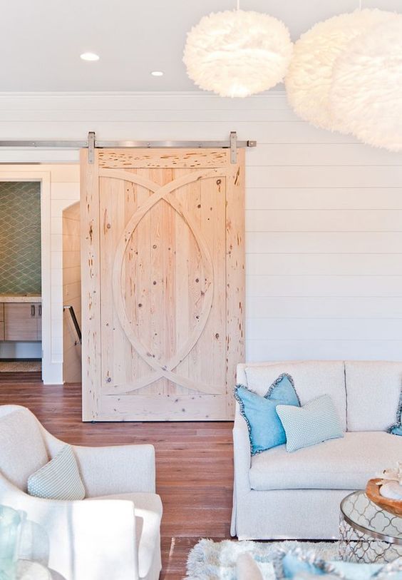 a rustic textural and patterned sliding door catches an eye and makes the space cozier