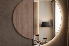 a semi circle mirror with a plywood half and lights built-in is a great art-like solution for a bedroom