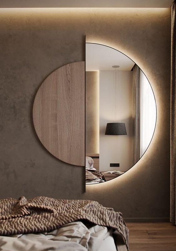 A semi circle mirror with a plywood half and lights built in is a great art like solution for a bedroom