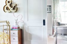 a simple white sliding door saves space in a small nursery and matches the interior very well