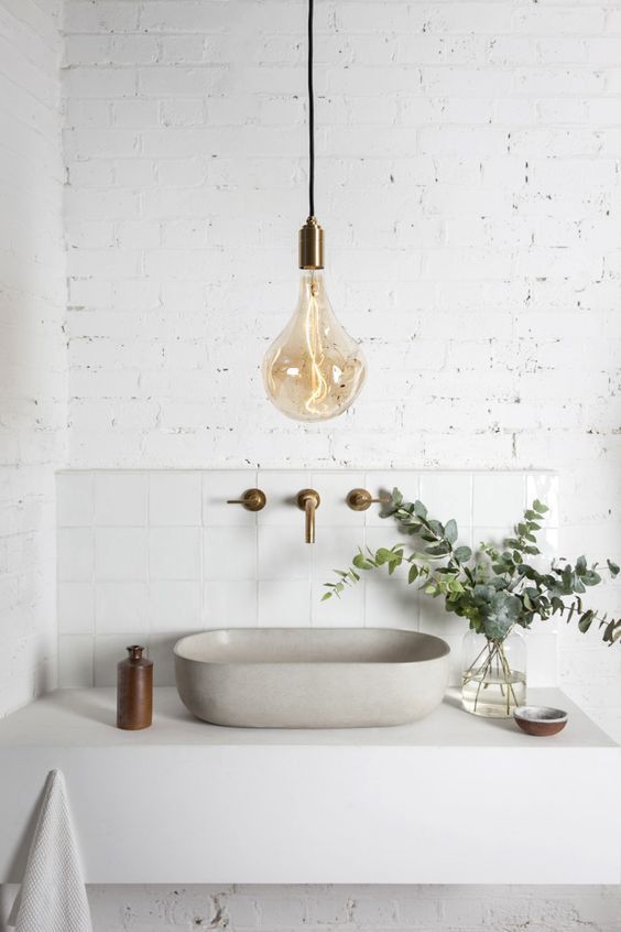 a single large bulb pendant lamp with a brass base is a cool and stylish modern idea to rock