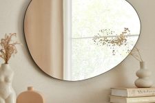 a soft pebble-shaped wall mirror will be a nice idea for a mid-century modern or Scandi space, it will be in harmony with the shapes around