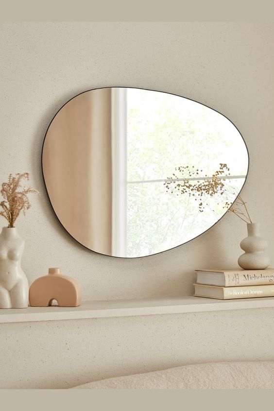 A soft pebble shaped wall mirror will be a nice idea for a mid century modern or Scandi space, it will be in harmony with the shapes around