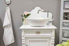 a vintage white cabinet or a nightstand can become a lovely and chic vintage bathroom vanity with plenty of storage space inside