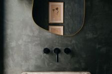 an irregularly shaped and asymmetric mirror in a brass freame is a great idea for many bathrooms, it will instantly give a unique touch to the space