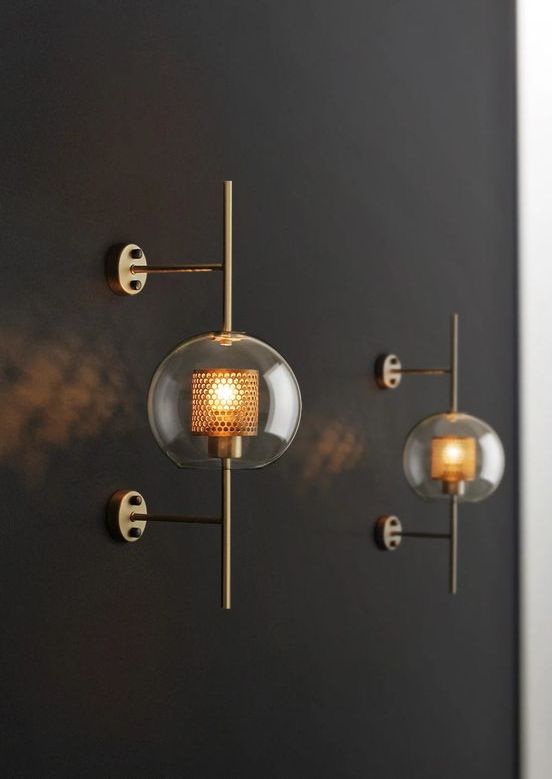catchy brass wall lamps of glass spheres and mini lampshades inside look chic and very bold