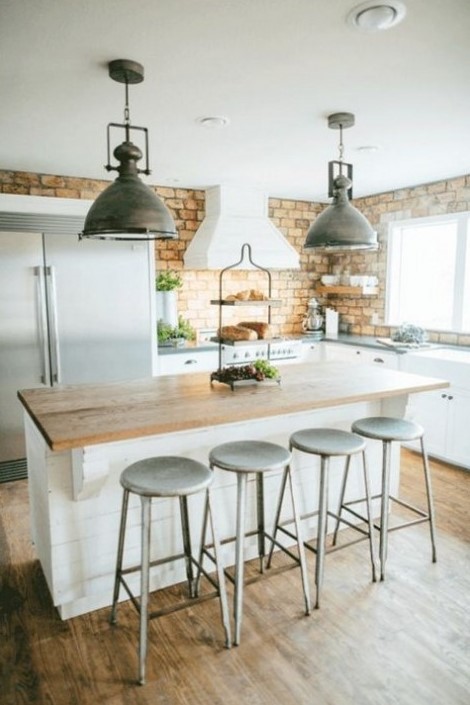a farmhouse kitchen with a yellow brick backsplash look cool and interesting and metal touches add a retro feel