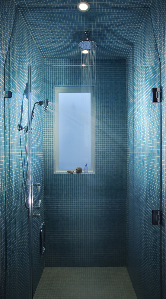 Blue mosaic tiles and a frosted glass window looks great together. (Leonard Grant Architecture)