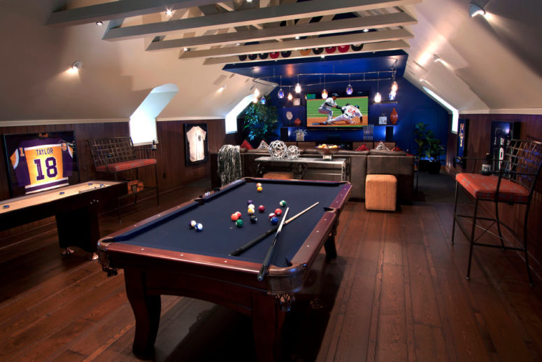 billiard's table and a dedicated TV area are perfect for a basement man cave (J. Hettinger Interiors)
