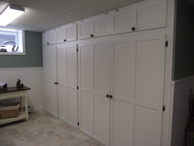 Floor to ceiling storage cabinets could be made by a carpenter.  (Carrie Greene Design)