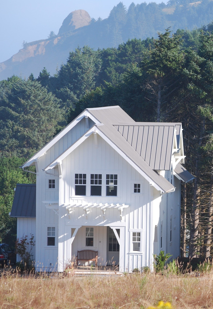 a mountain house with a small front porch and metal roofing (Duncan McRoberts Associates, LLC)