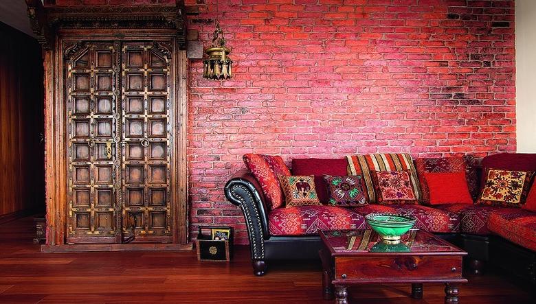 Oriental Apartment Where The Living Room Features Bold Red Brick Wall