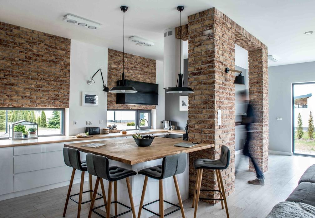 02 Brick gates or beams highlight the kitchen, and various shades of grey create an effect of optical depth